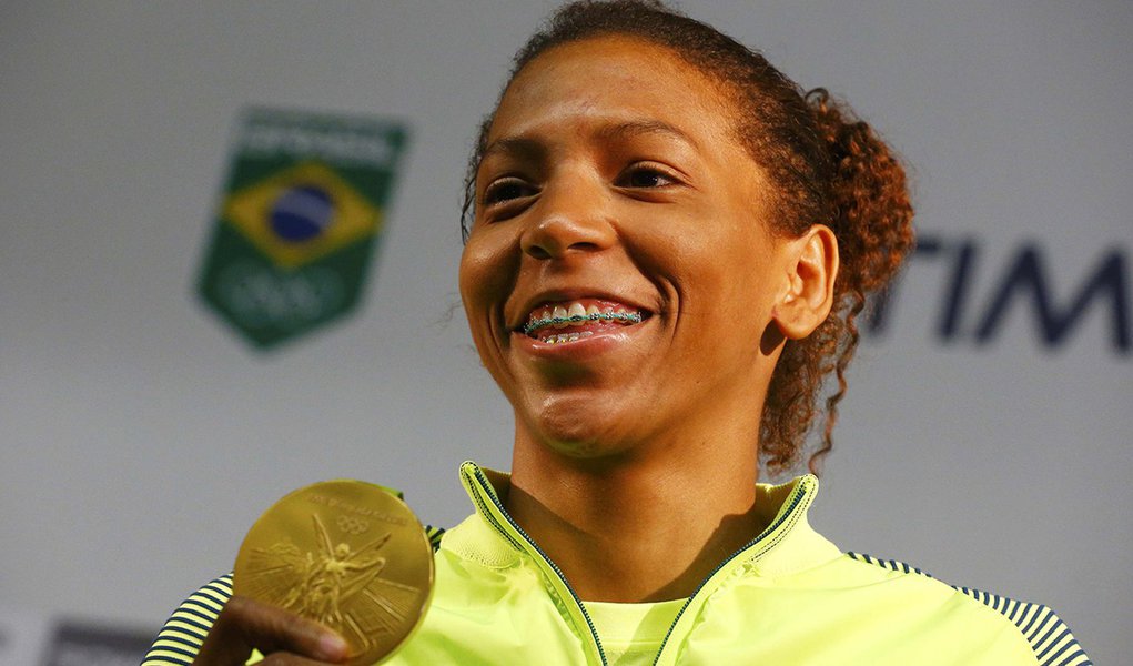 2016 Rio Olympics - Judo - Women - 57 kg - Rio de Janeiro, Brazil - 09/08/2016. Rafaela Silva holds her gold medal during a press conference. REUTERS/Nacho Doce Picture Supplied by Action Images