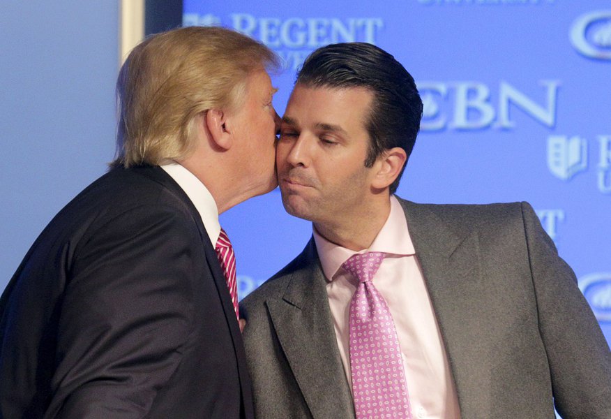 U.S. Republican presidential candidate Donald Trump kisses his son Donald, Jr. at a campaign event at Regents University in Virginia Beach, Virginia February 24, 2016. REUTERS/Joshua Roberts - RTX28EY5