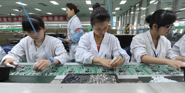 Chinese workers assembling circuit boards at a factory in Mianyang, southwest China's Sichuan province on April 30, 2012. China's manufacturing activity rose in April to a 13-month high, o