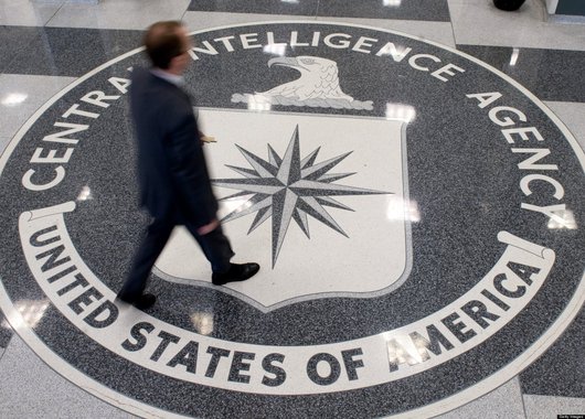 A man crosses the Central Intelligence Agency (CIA) logo in the lobby of CIA Headquarters in Langley, Virginia, on August 14, 2008. AFP PHOTO/SAUL LOEB (Photo credit should read SAUL LOEB/AFP/Getty Images)