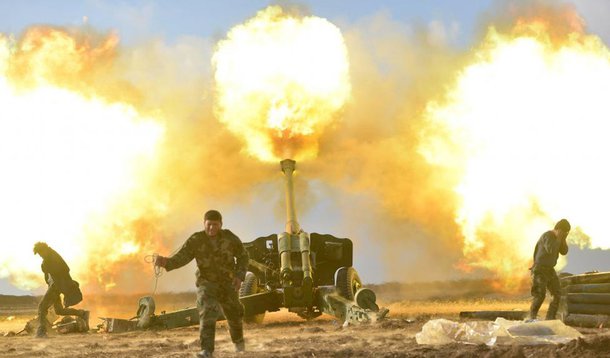 Members of Hashid Shaabi or Popular Mobilization Forces (PMF) fire towards Islamic State militant positions in west of Mosul. REUTERS/Stringer