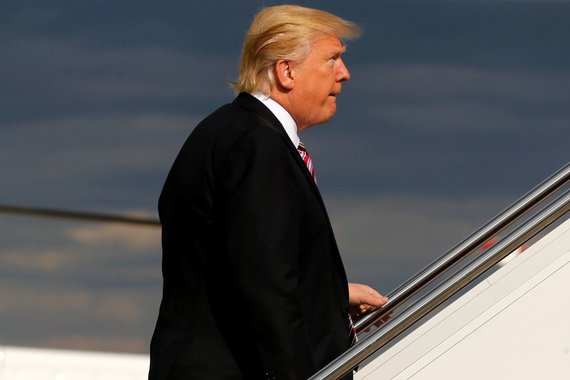 U.S. President Donald Trump boards Air Force One for travel to Philadelphia from Joint Base Andrews, Maryland, U.S. January 26, 2017. REUTERS/Jonathan Ernst