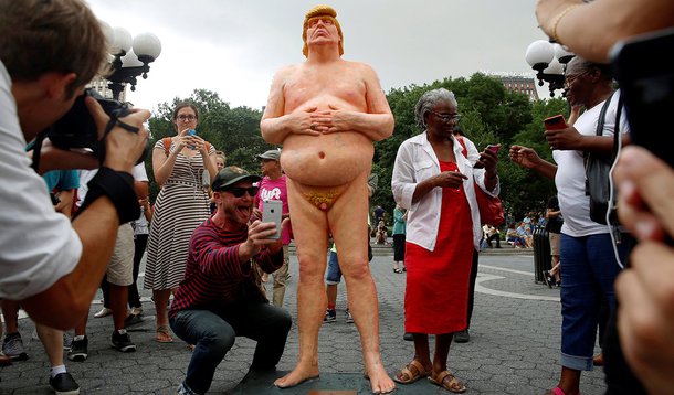 REFILE - REMOVING RESTRICTIONS People photograph and pose for selfies with a naked statue of U.S. Republican presidential nominee Donald Trump that was left in Union Square Park in New York City, U.S. August 18, 2016. REUTERS/Brendan McDermid TEMPLATE OUT