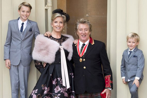 LONDON, ENGLAND - OCTOBER 11: Sir Rod Stewart with his wife, Penny Lancaster and children Alastair and Aiden after he receiv