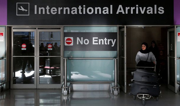 An international traveler arrives after U.S. President Donald Trump's executive order travel ban at Logan Airport in Boston, Massachusetts, U.S. January 30, 2017. REUTERS/Brian Snyder