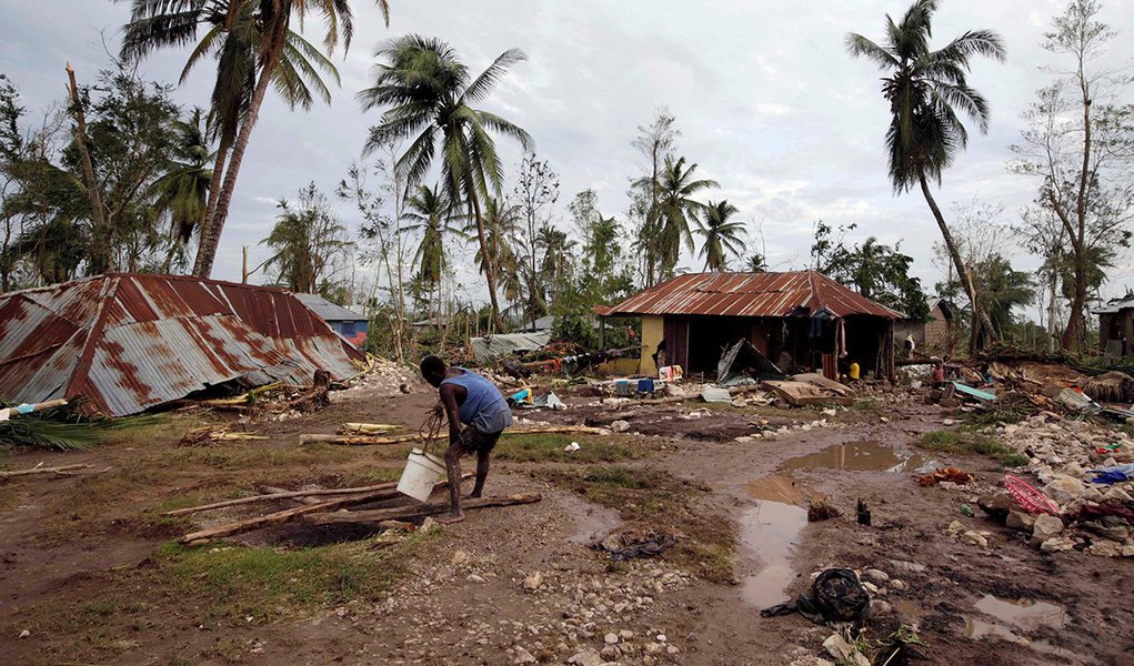 A man gets water from a well in an area destroyed by Hurricane Matthew in Cavaillon. REUTERS/Andres Martinez Casares