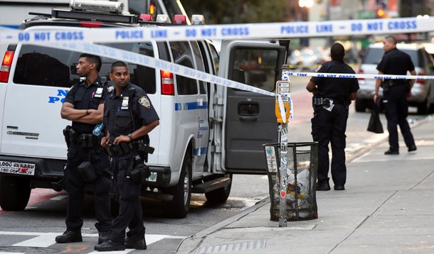New York City Police Department (NYPD) officers stand near the site of an explosion in the Chelsea neighborhood of Manhattan, New York, U.S. September 18, 2016. REUTERS/Rashid Umar Abbasi