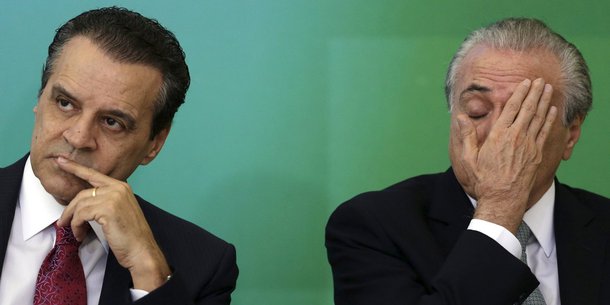 The new Minister of Tourism Henrique Eduardo Alves reacts near of Brazil's Vice President Michel Temer (R) during his inauguration at the Planalto Palace in Brasilia April 16, 2015. REUTERS/Ueslei Marcelino