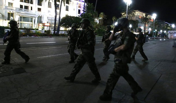 French soldiers advance on the street after at least 30 people were killed in Nice, France, when a truck ran into a crowd celebrating the Bastille Day national holiday July 14, 2016. REUTERS/Eric Gaillard