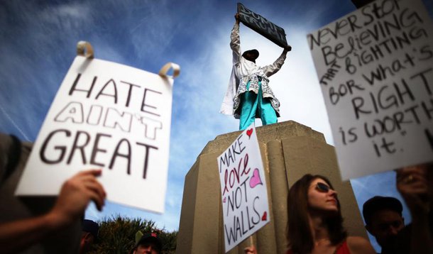 Reuters / Saturday, November 12, 2016 Protesters hold up signs during a march and rally against President-elect Donald Trump in Los Angeles, California.