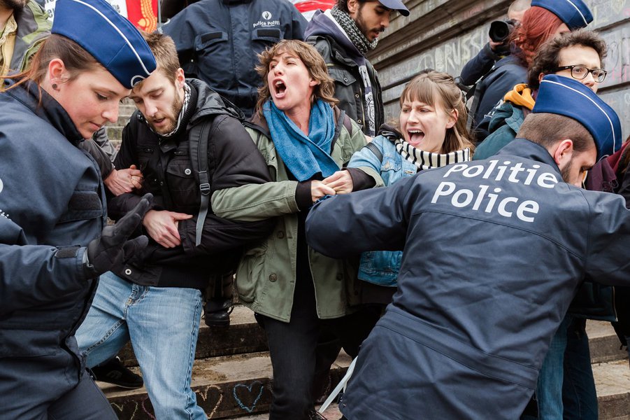 Police detain a group of people at the Place de la Bourse in Brussels, Belgium, Saturday, April 2, 2016.(AP Photo/Geert Vanden Wijngaert)