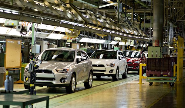 Pre-production 2013 Mitsubishi Outlander Sports travel on the assembly line at the Mitsubishi Motors North America manufacturing facility in Normal, Illinois, U.S., on Tuesday, July 17, 2012. Photographer: Daniel Acker