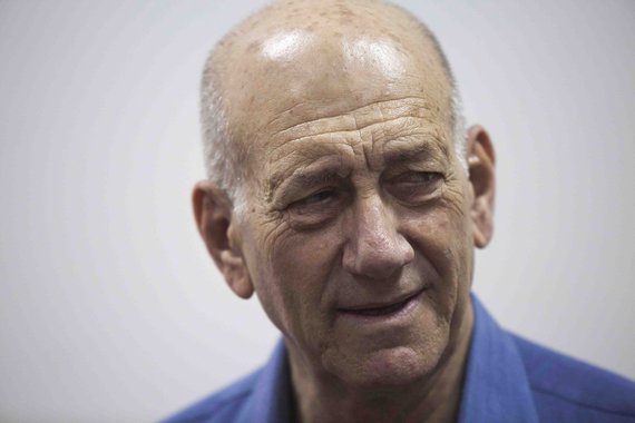 Former Israeli Prime Minister Ehud Olmert appears in Jerusalem District Court May 25,2015. Olmert was sentenced on Monday eight months in jail for accepting illegal payments from a U.S. businessman, having previously been given a six-year term in a separa