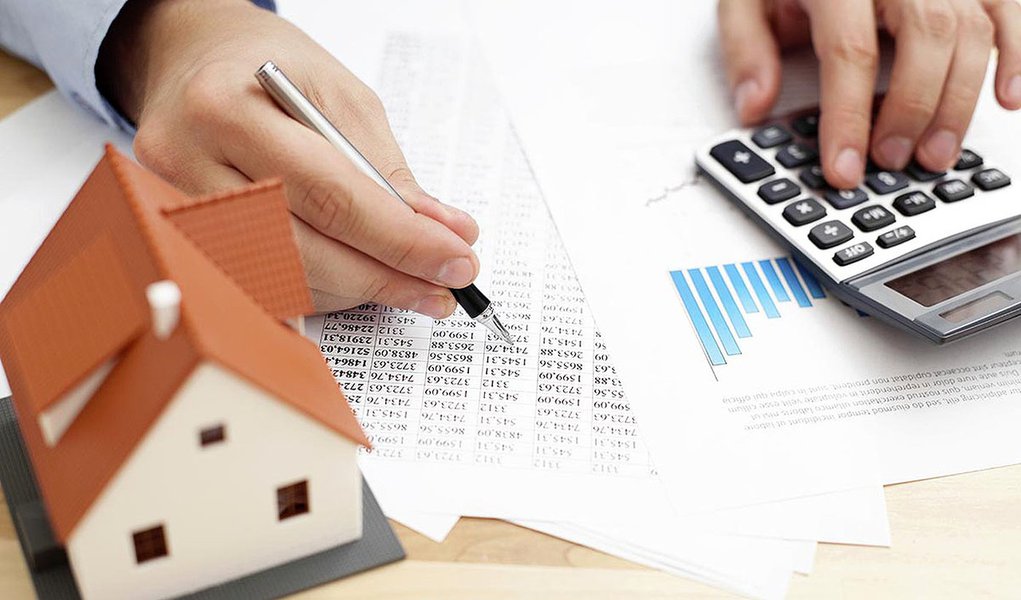 Closeup of man counting payments for home