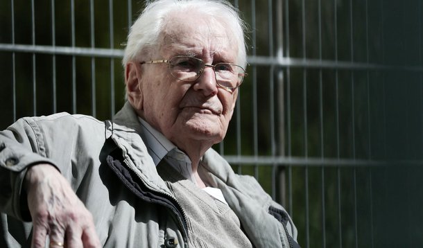 Former SS guard Oskar Groening, 93, sits in ths sun during a break in his trial in Lueneburg, Germany, on April 21, 2015.