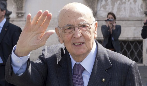 Italian President Giorgio Napolitano waves at the end of a meeting with the "wise men" at the Quirinale palace in Rome in this picture provided by the Italian Presidency Press Office April 12, 2013. The panel of "wise men" named last month to help end the