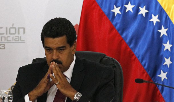 Venezuela's interim President Nicolas Maduro sits as he waits for the official ceremony at the Electoral Council to certify his victory on Sunday's presidential election in Caracas, Venezuela, Monday, April 15, 2013. Venezuela's government-friendly electo