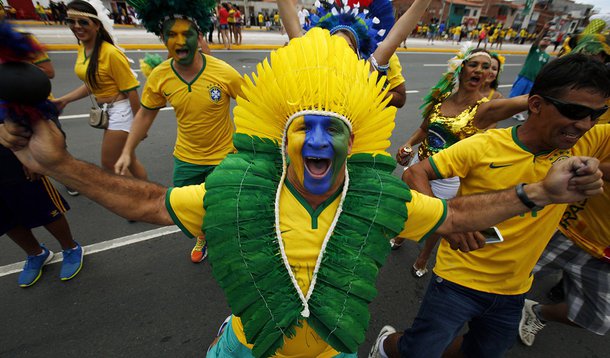 A Brazilian fan shows off his outfit on his way to the Arena Castelao for the group A World Cup soccer match between Brazil and Mexico in Fortaleza, Brazil, Tuesday, June 17, 2014.  (AP Photo/Eduardo Verdugo)