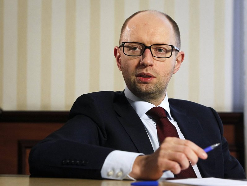 Ukrainian Prime Minister Arseny Yatseniuk listens during an interview with Reuters in Kiev April 3, 2014. The Kiev government will stick to unpopular austerity measures "as the price of independence" as Russia steps up pressure on Ukraine to destabilize i