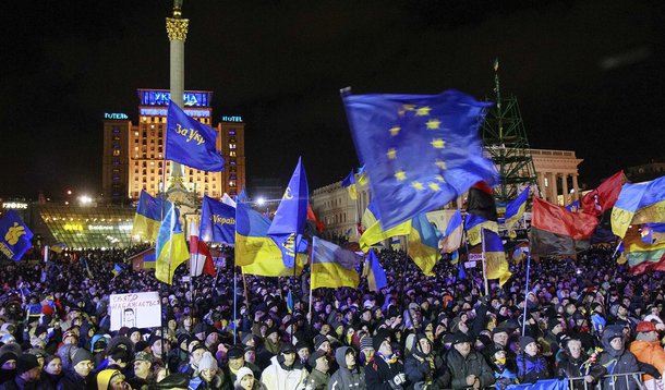 People supporting EU integration attend a rally in Kiev, December 2, 2013. Ukrainian protesters blockaded the main government building on Monday, seeking to force President Viktor Yanukovich from office with a general strike after hundreds of thousands de