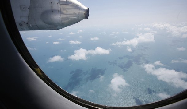 Clouds hover outside the window of a Vietnam Air Force search and rescue aircraft An-26 on a mission to find the missing Malaysia Airlines flight MH370, off Vietnam's Tho Chu island March 10, 2014. The disappearance of a Malaysian airliner about an hour i