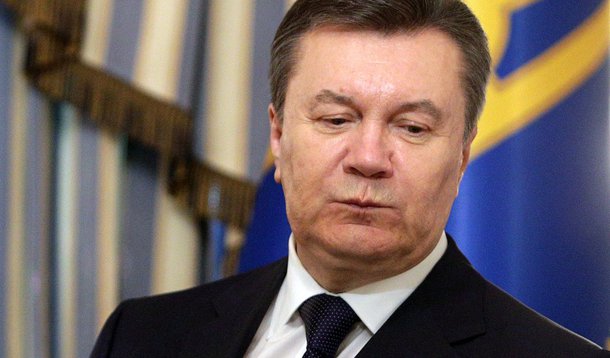 Ukraine's President Viktor Yanukovich looks on during a signing ceremony of an EU-mediated peace deal with opposition leaders at the presidential headquarters in Kiev in this picture taken on February 21, 2014. Protesters seized the Kiev office of Preside