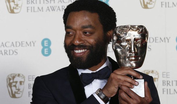 Actor Chiwetel Ejiofor celebrates after winning Best Actor for "12 Years a Slave" at the British Academy of Film and Arts (BAFTA) awards ceremony at the Royal Opera House in London February 16, 2014.        REUTERS/Suzanne Plunkett (BRITAIN - Tags: ENTERT