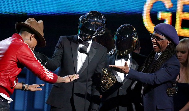 From left, Pharrell Williams, Daft Punk and Nile Rodgers accept the award for best pop/duo group performance at the 56th annual GRAMMY Awards at Staples Center on Sunday, Jan. 26, 2014, in Los Angeles. (Photo by Matt Sayles/Invision/AP)