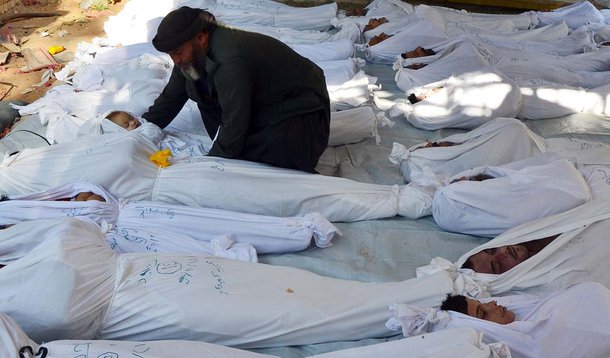 ATTENTION EDITORS - VISUALS COVERAGE OF SCENES OF DEATH AND INJURY
A man holds the body of a dead child among bodies of people activists say were killed by nerve gas in the Ghouta region, in the Duma neighbourhood of Damascus August 21, 2013. Syrian acti