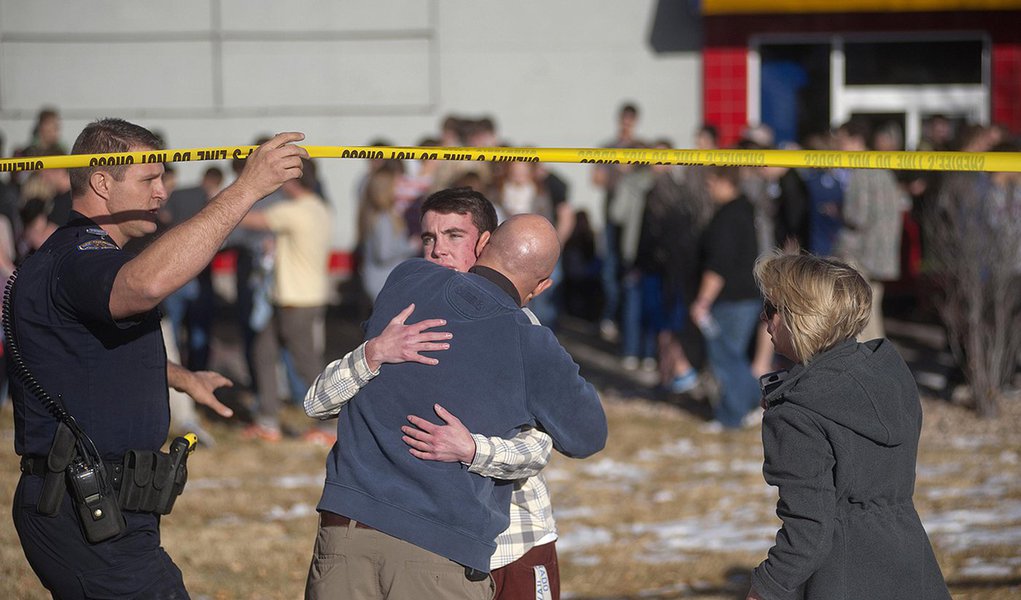 Students gather and reunite with their parents at a fast food joint across from Arapahoe High School, after a student opened fire in the school in Centennial, Colorado December 13, 2013. The student seeking to confront one of his teachers opened fire at t