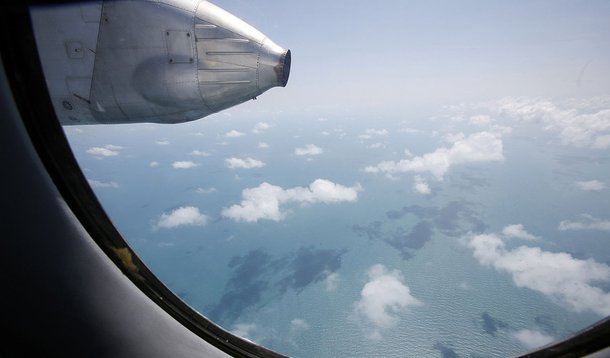 Clouds hover outside the window of a Vietnam Air Force search and rescue aircraft An-26 on a mission to find the missing Malaysia Airlines flight MH370, off Vietnam's Tho Chu island March 10, 2014. The disappearance of a Malaysian airliner about an hour i