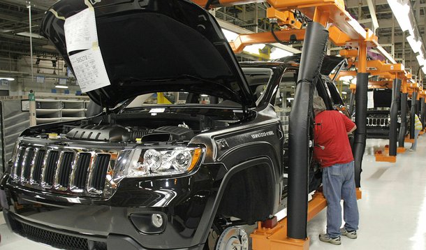 DETROIT -  MAY 21:  A Chrysler employee works on the assembly line making the new Jeep Grand Cherokee at the Chrysler Jefferson Avenue Plant May 21, 2010 in Detroit, Michigan. The 2011 Jeep Grand Cherokee is Chrysler's first new vehicle to be introduced s