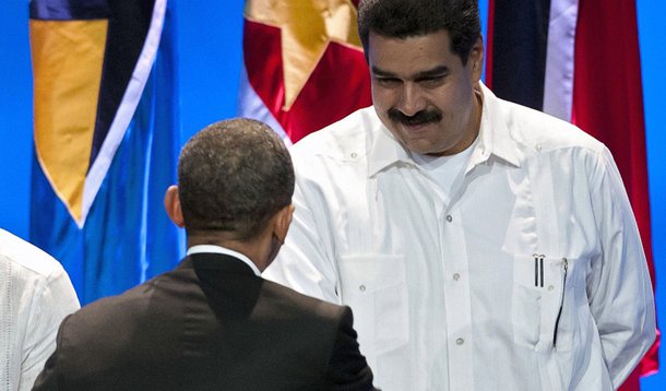 US President Barack Obama (C) shakes hands with Venezuelan Foreign Minister Nicolas Maduro (R) next to Haitian Foreign Minister Laurent Lamothe during the opening remarks of the Summit of the Americas at the Julio Cesar Turbay Ayala Convention Center in C