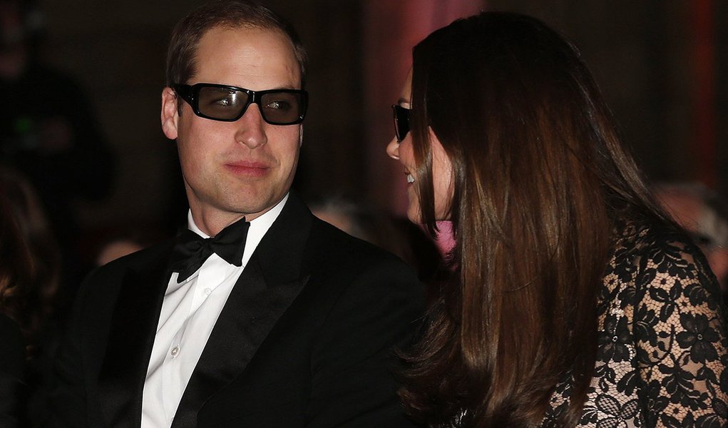 Britain's Prince William and his wife Catherine, the Duchess of Cambridge, wear 3D glasses before a screening of "David Attenborough's Natural History Museum Alive 3D" at the Natural History Museum in London December 11, 2013. REUTERS/Suzanne Plunkett