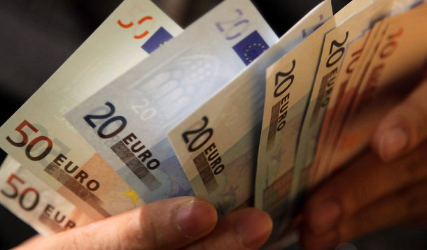 A man counts euro notes in this arranged photograph in Tokyo, Japan, on Thursday, Dec. 29, 2011. The euro weakened to a decade low against the yen before Italy auctions as much as 8.5 billion euros ($11 billion) of debt. European shares and U.S. equity-in
