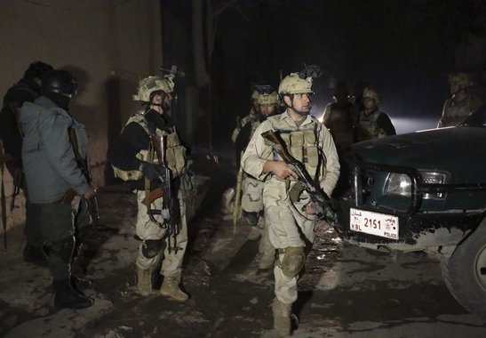 Afghan security forces arrive at the scene of an explosion in Kabul January 17, 2014. At least 13 people, including both Afghans and foreigners, were killed when a suicide bomber blew himself up near a popular Lebanese restaurant in the Afghan capital Kab