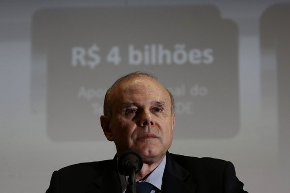 Brazil's Finance Minister Guido Mantega attends the announcement of the measures that the Brazilian government intends to take to the electricity sector in Brasilia March 13, 2014. Brazil's government will allow an increase in electricity rates to help di