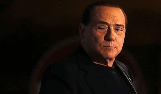 Former Prime Minister Silvio Berlusconi looks on during a speech from the stage in downtown Rome November 27, 2013. The Italian Senate opened its debate on expelling Silvio Berlusconi on Wednesday, ahead of an evening vote that is expected to see the vete