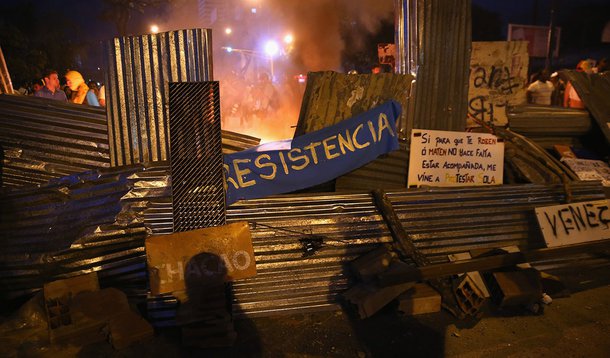 CARACAS, VENEZUELA - MARCH 02:  A fire burns behind a barricade during an anti-government demonstration on March 2, 2014 in Caracas, Venezuela. With one of the highest inflation rates in the world, Venezuela has been in turmoil for almost three weeks as o