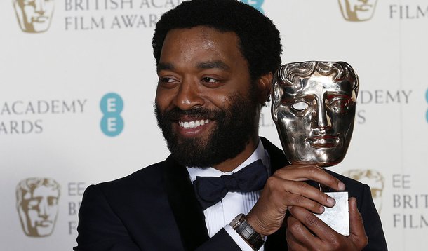 Actor Chiwetel Ejiofor celebrates after winning Best Actor for "12 Years a Slave" at the British Academy of Film and Arts (BAFTA) awards ceremony at the Royal Opera House in London February 16, 2014.        REUTERS/Suzanne Plunkett (BRITAIN - Tags: ENTERT