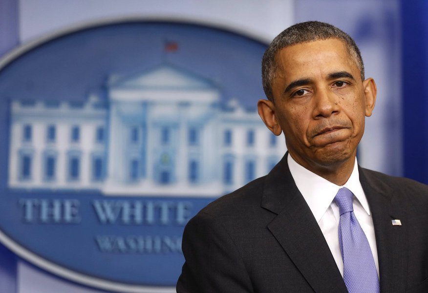 U.S. President Barack Obama pauses while talking about the Affordable Care Act in the Brady Press Briefing Room at the White House in Washington, November 14, 2013. Obama bowed to political pressure from his fellow Democrats on Thursday and announced a pl