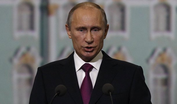 Russian President Vladimir Putin addresses participants of the St. Petersburg International Economic Forum in St. Petersburg, June 21, 2013. Putin on Friday defended Russian arms deals with Syrian President Bashar al-Assad's government and said the West s