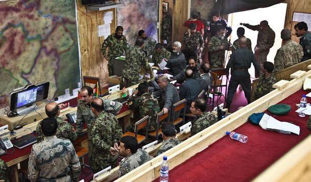 Afghan National Security Forces discuss strategies in the Operations Coordination Center - Regional East during the election day at Forward Operating Base Thunder, Paktia province, Afghanistan, April 5, 2014. The security forces were responsible for ensur