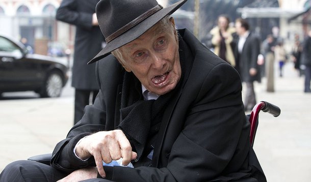Great Train Robber Ronnie Biggs arrives in a wheelchair for the funeral of Bruce Reynolds, at the church of St Bartholomew the Great in London March 20, 2013. Reynolds, the key planner behind the Great Train Robbery in 1963, died at the age of 81 in Febru