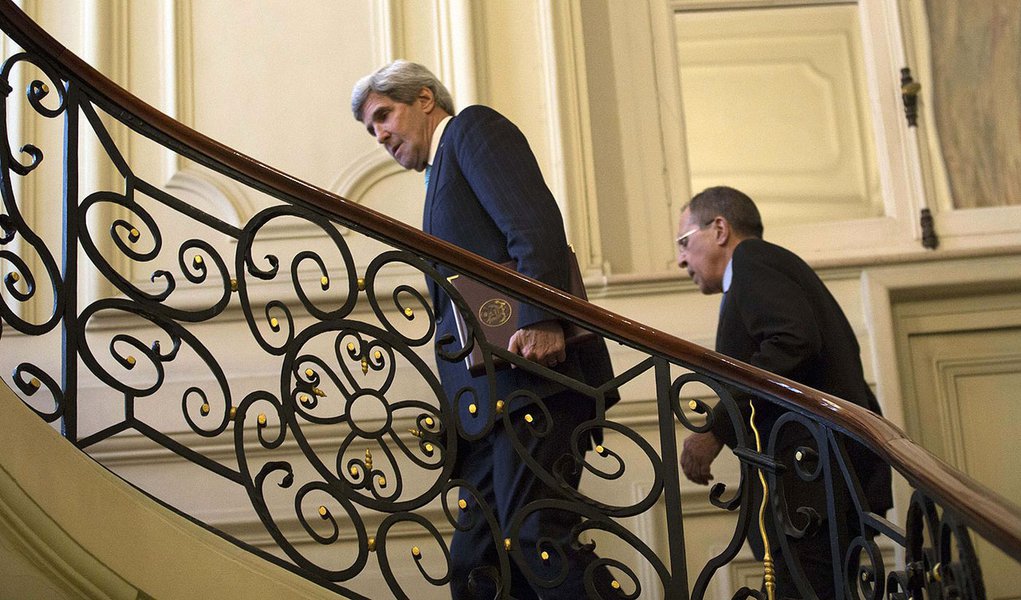 U.S. Secretary of State John Kerry, trailed by Russian Foreign Minister Sergei Lavrov, ascends the steps of the Russian Ambassador's Residence for their meeting  in Paris, March 5, 2014. Russia rebuffed Western demands to withdraw forces in Ukraine's Crim
