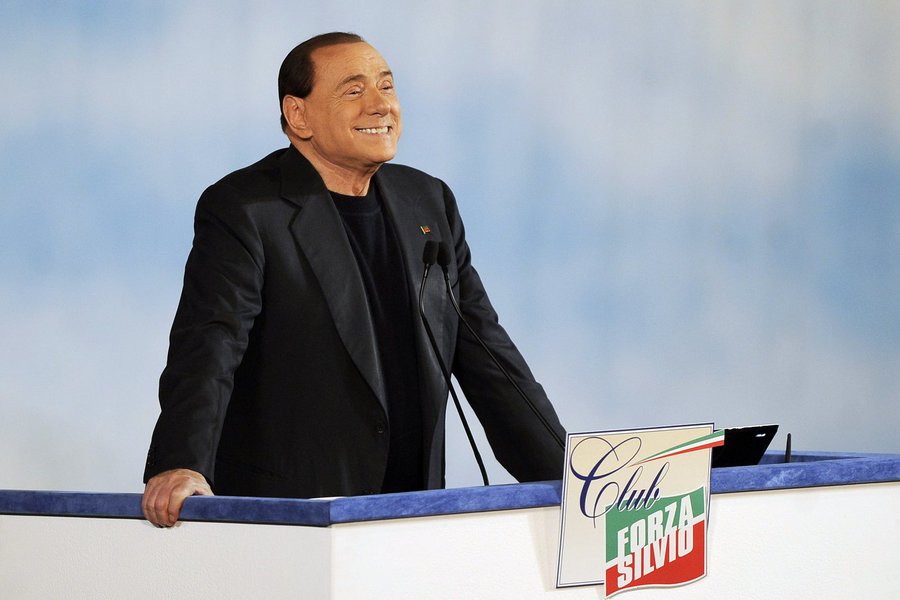 Former Italian Prime Minister Silvio Berlusconi reacts as he attends a rally to launch the "Forza Silvio" (Go Silvio) club in downtown Rome December 8, 2013. REUTERS/Yara Nardi (ITALY - Tags: POLITICS)
