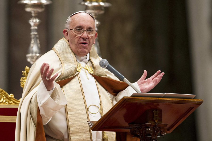Pope Francis reacts during a rite of acceptance into the Catechumenate and meeting with the Catechumens at the St. Peter Basilica in Vatican November 23, 2013. REUTERS/Giampiero Sposito (VATICAN - Tags: RELIGION)