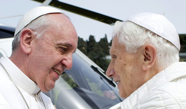 Pope Francis (L) embraces Pope Emeritus Benedict XVI as he arrives at the Castel Gandolfo summer residence March 23, 2013. Pope Francis travelled by helicopter from the Vatican to Castel Gandolfo for a private meeting with the former Pope Benedict XVI.   