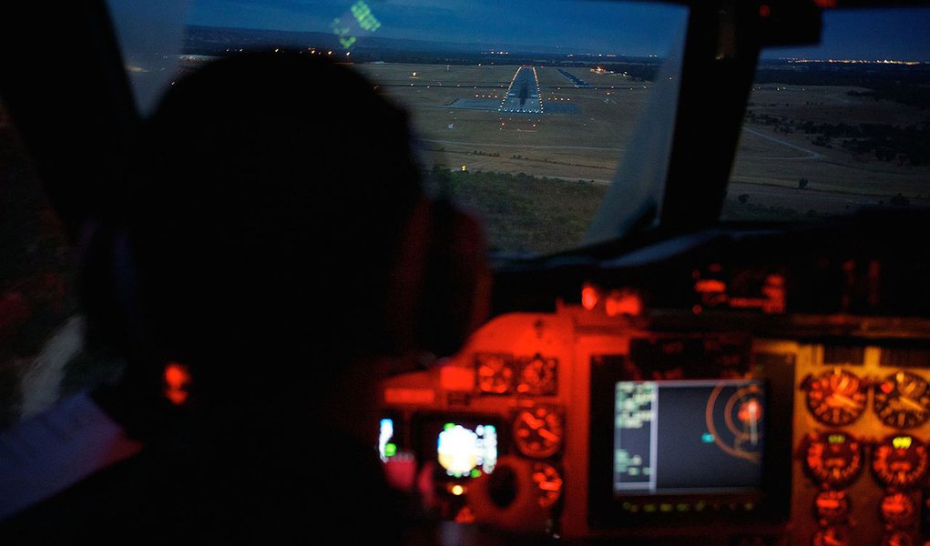 Co-Pilot, Flying Officer Marc Smith, flies his Royal Australian Air Force (RAAF) AP-3C Orion aircraft towards the runway at RAAF Pearce Base in Bullsbrook near Perth March 24, 2014, after searching for the missing Malaysian Airlines Flight MH370. An Austr