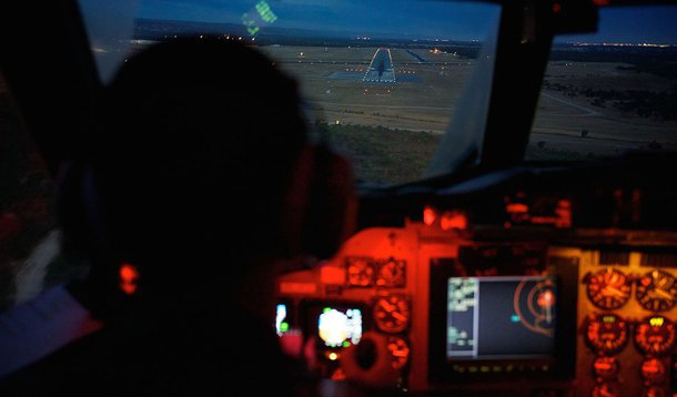 Co-Pilot, Flying Officer Marc Smith, flies his Royal Australian Air Force (RAAF) AP-3C Orion aircraft towards the runway at RAAF Pearce Base in Bullsbrook near Perth March 24, 2014, after searching for the missing Malaysian Airlines Flight MH370. An Austr